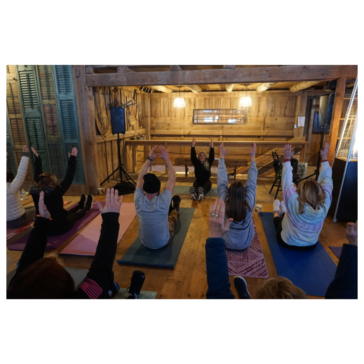 Participants stretching together during a retreat session
