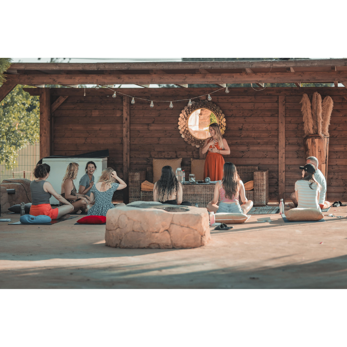 Team sitting in a circle during an outdoor retreat